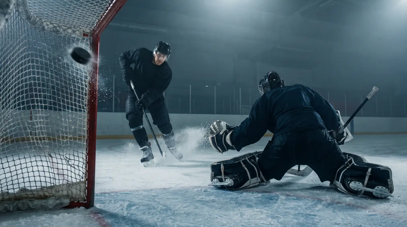 NHL forward burying a shot past the goalie at close range