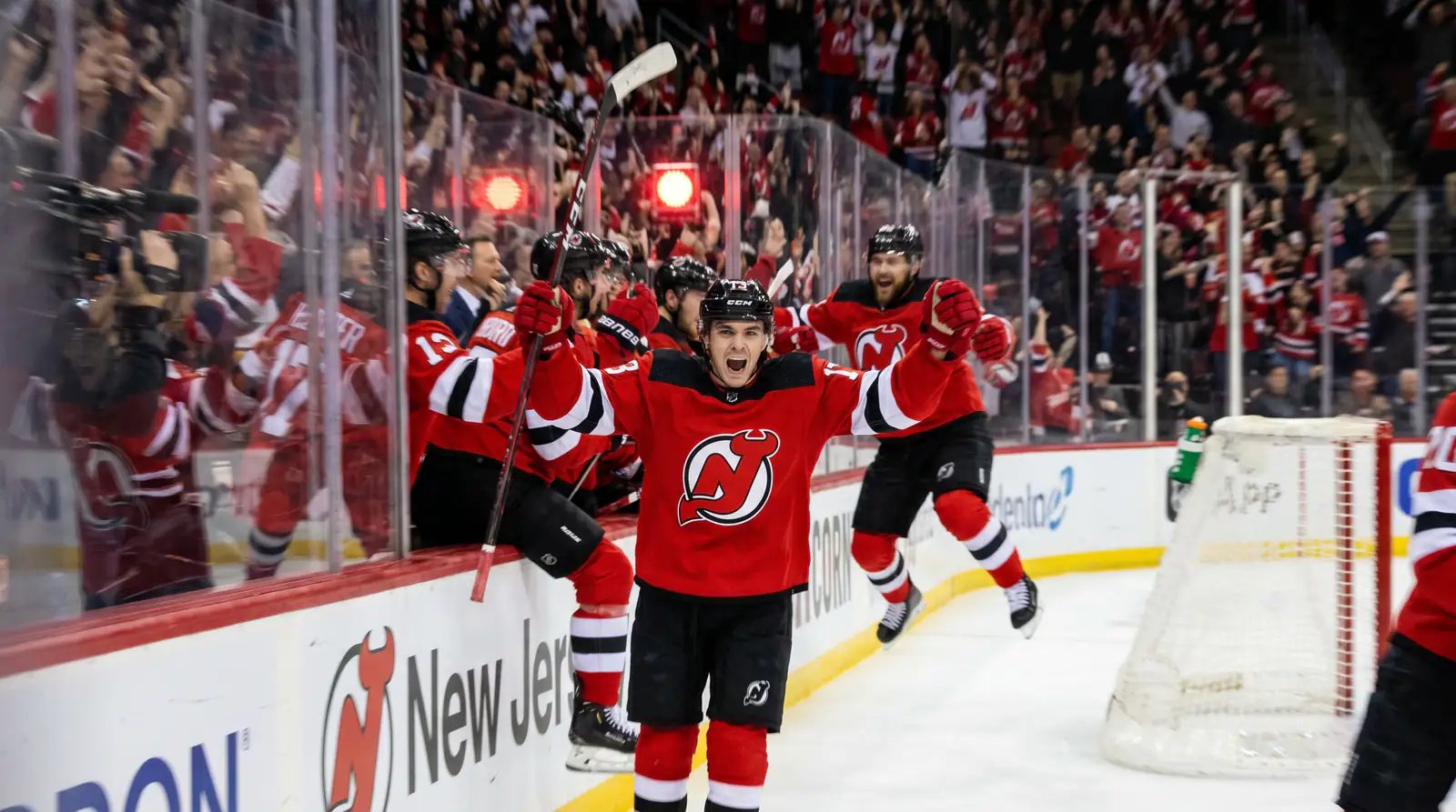 Same-game NHL parlay scenario with goalscorer and total combined