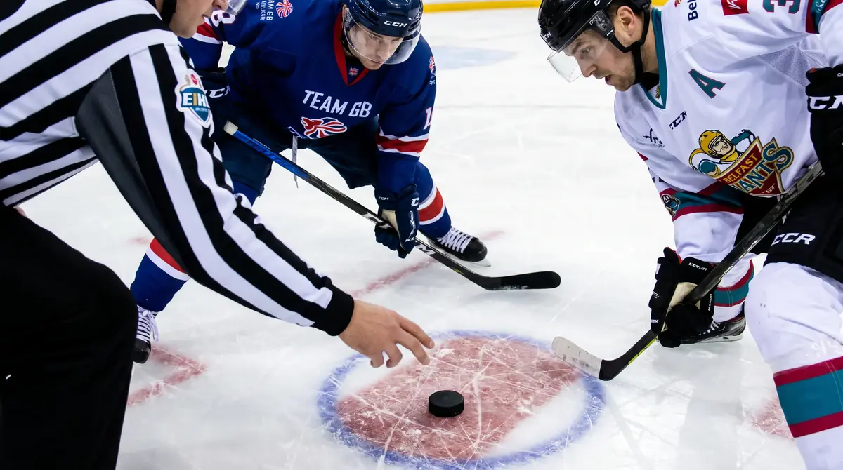 EIHL referee dropping the puck at the centre circle between two British league teams