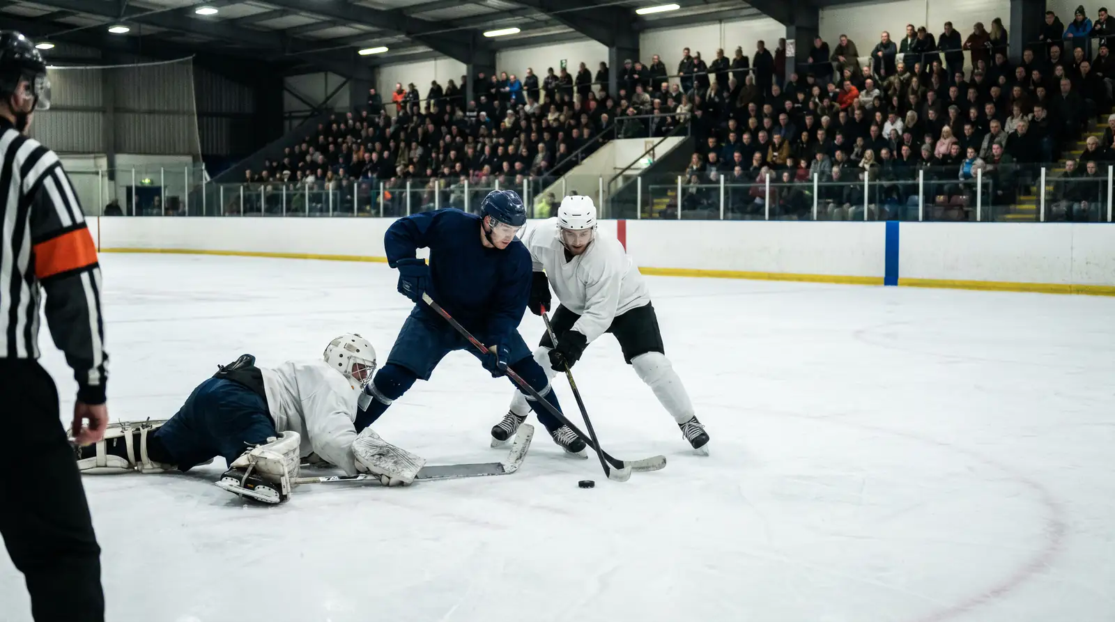 EIHL players battling in front of the net during a weekend home game