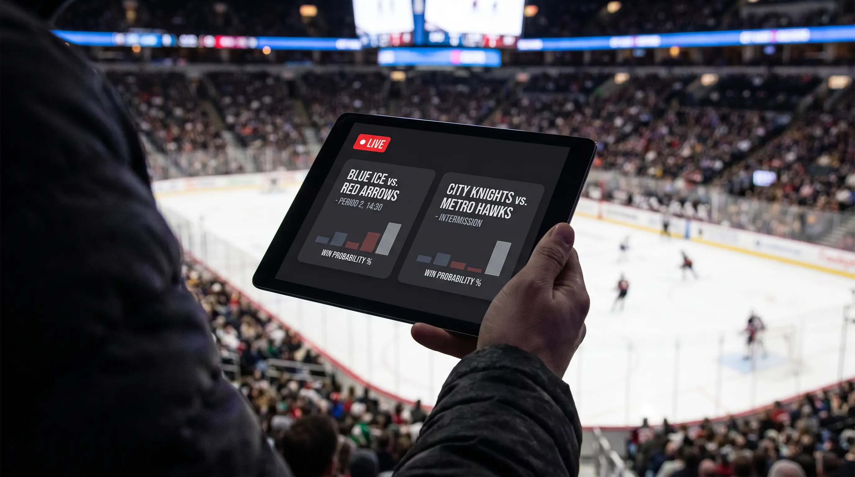 Tablet held by a spectator in an arena seat with the rink visible below