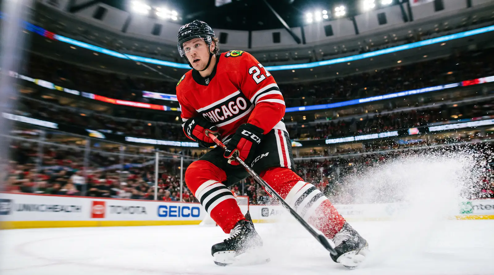 NHL forward sprinting up the wing at full speed during a live match