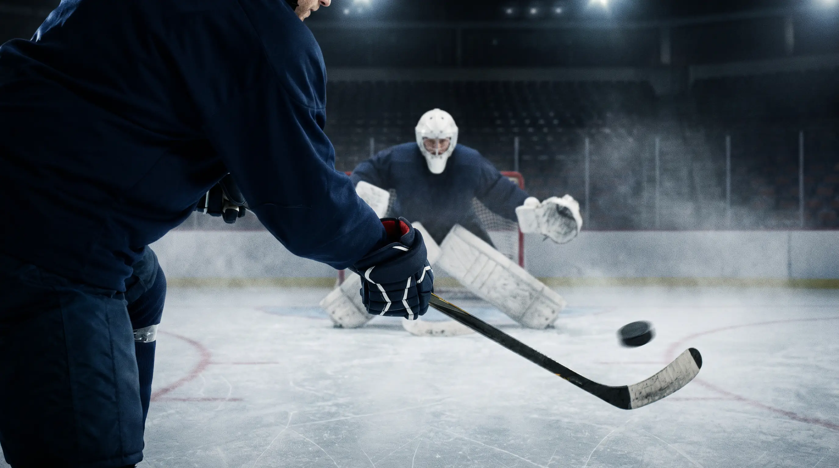 NHL forward firing a shot on net from close range