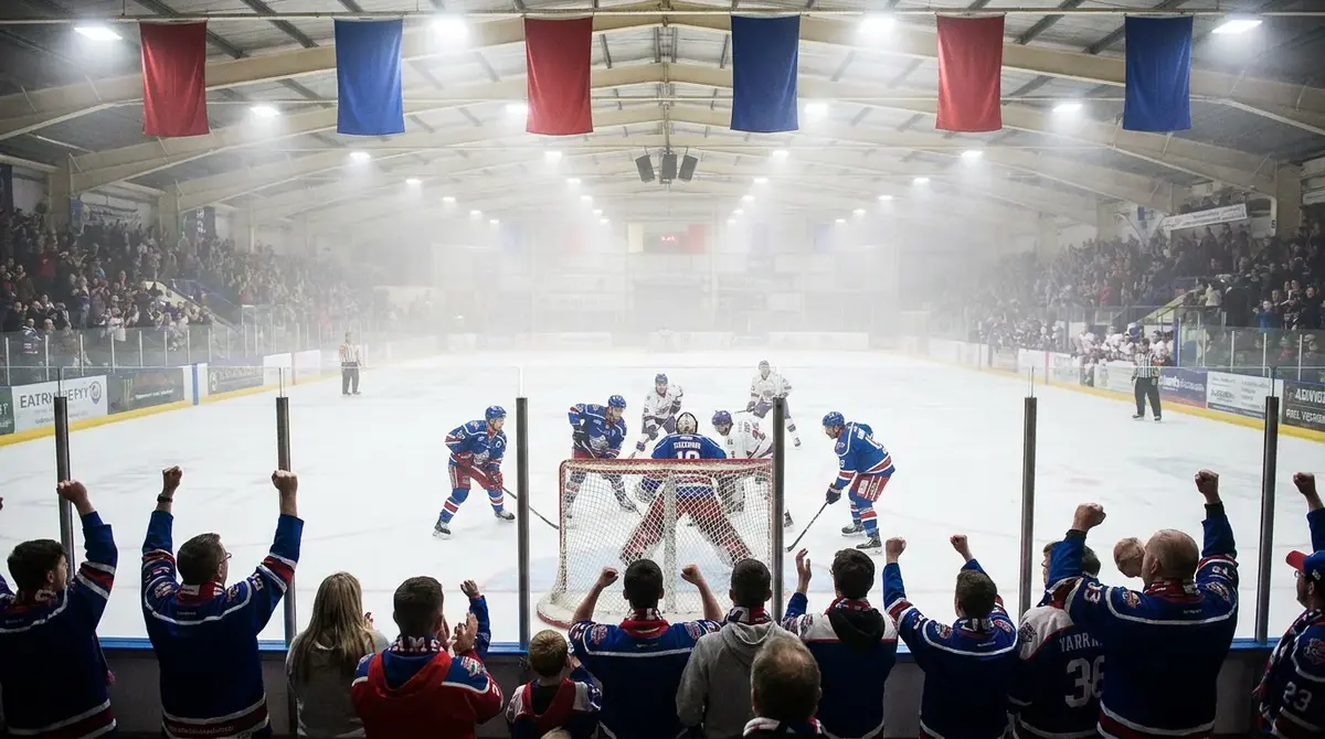 Packed arena at a British Elite Ice Hockey League match with home supporters in team colours