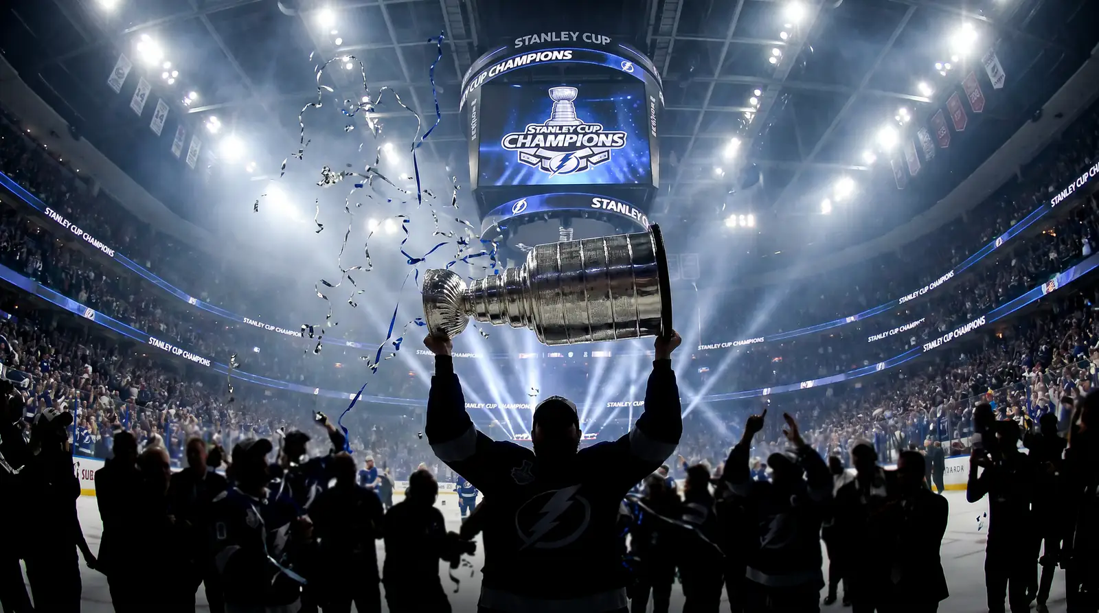 Stanley Cup trophy raised under bright arena spotlights after the final